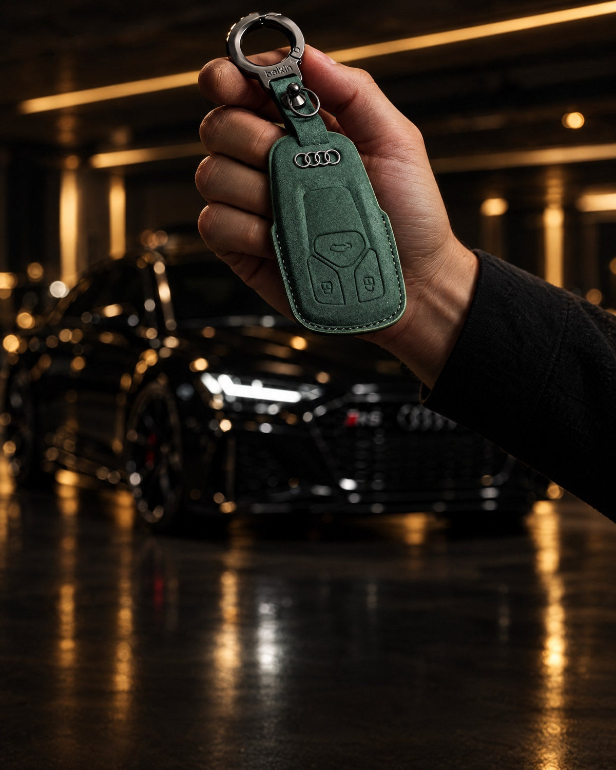 Green suede Audi key cover in front of an Audi RS